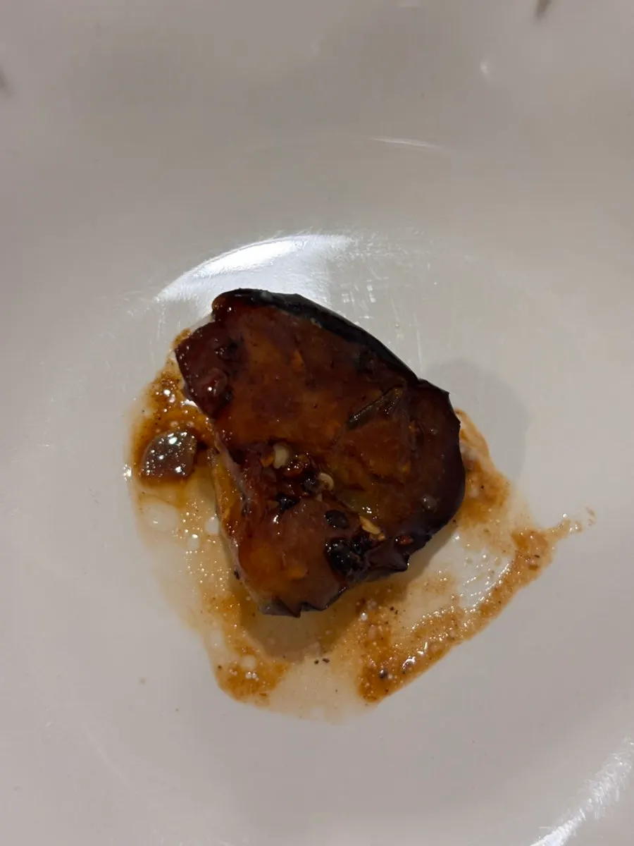 A sliced cross-section of the pork neck steak