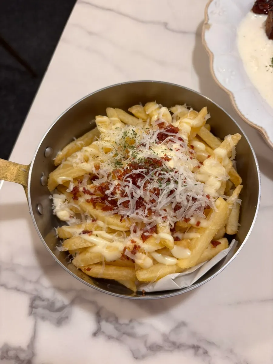 A plate of cream onion fries