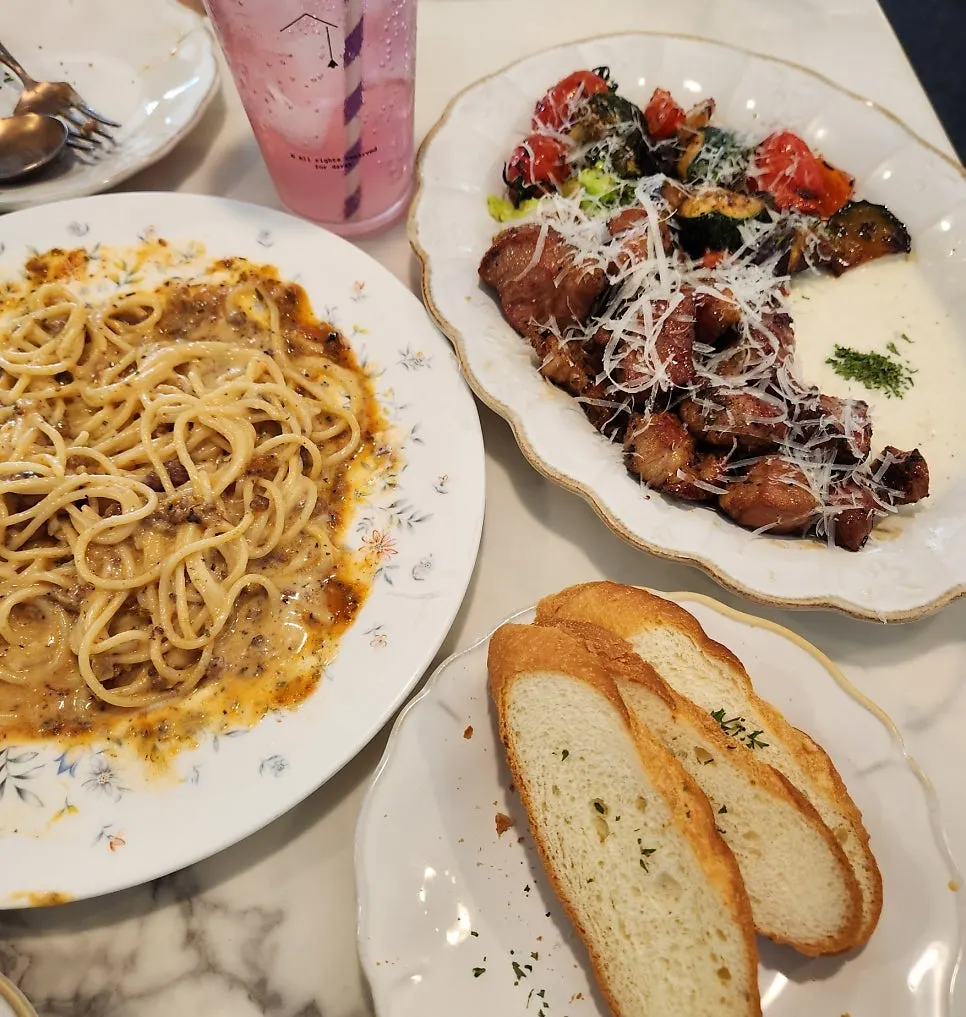 A full spread of Darak Rose Pasta and chap mokssal steak
