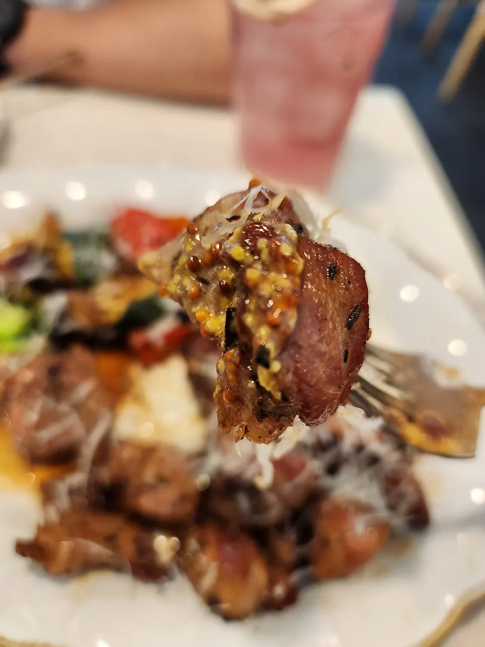 A piece of pork collar steak with grilled vegetables
