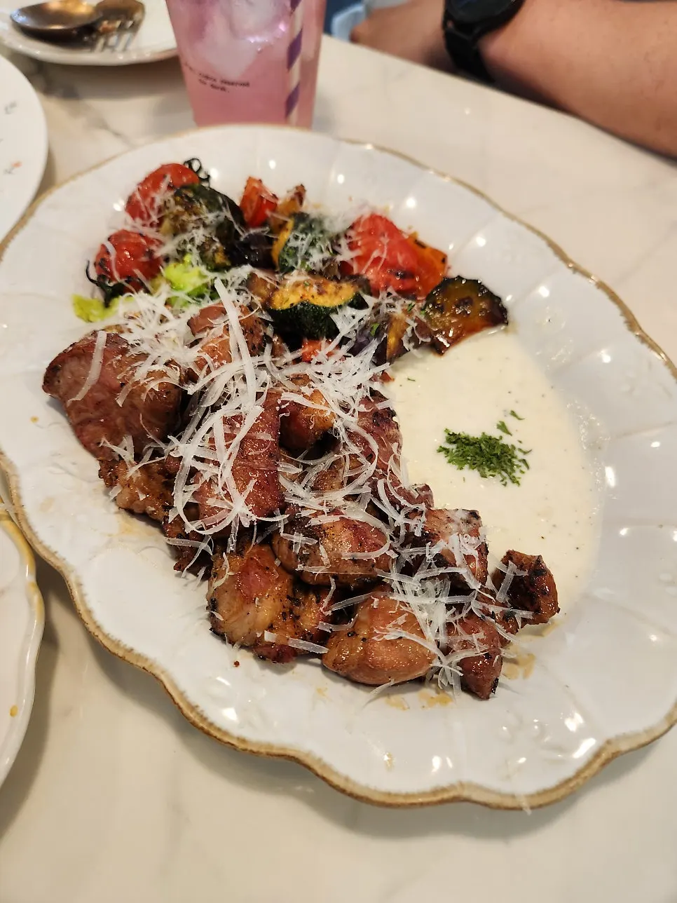 Lemonade served alongside pasta and steak