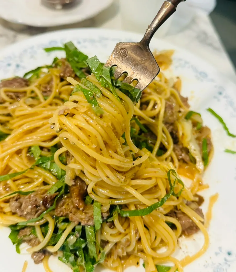 Perilla pasta noodles twirled up on a fork