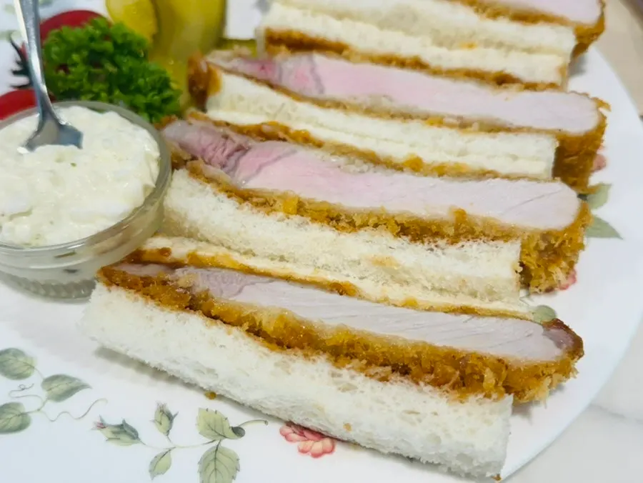 A bitten katsu sando showing the meat inside