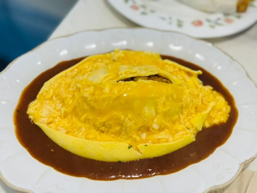 Egg omelet cut open and unfurled like a swirl