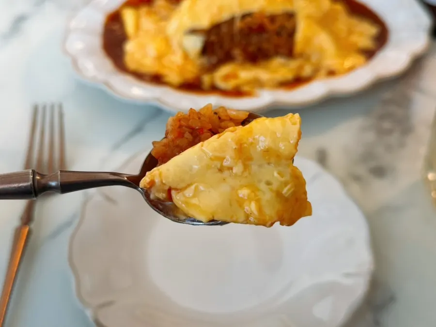 A spoonful of omelet rice