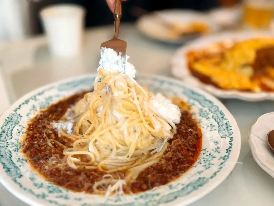 Rosé pasta with meat sauce and cream mixed together