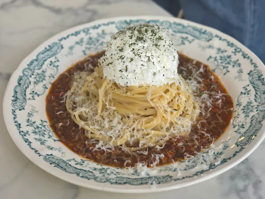Rose pasta topped with house-made meat sauce