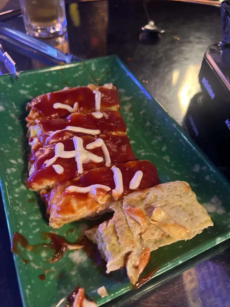 Cross-section of the egg roll showing the cheese inside