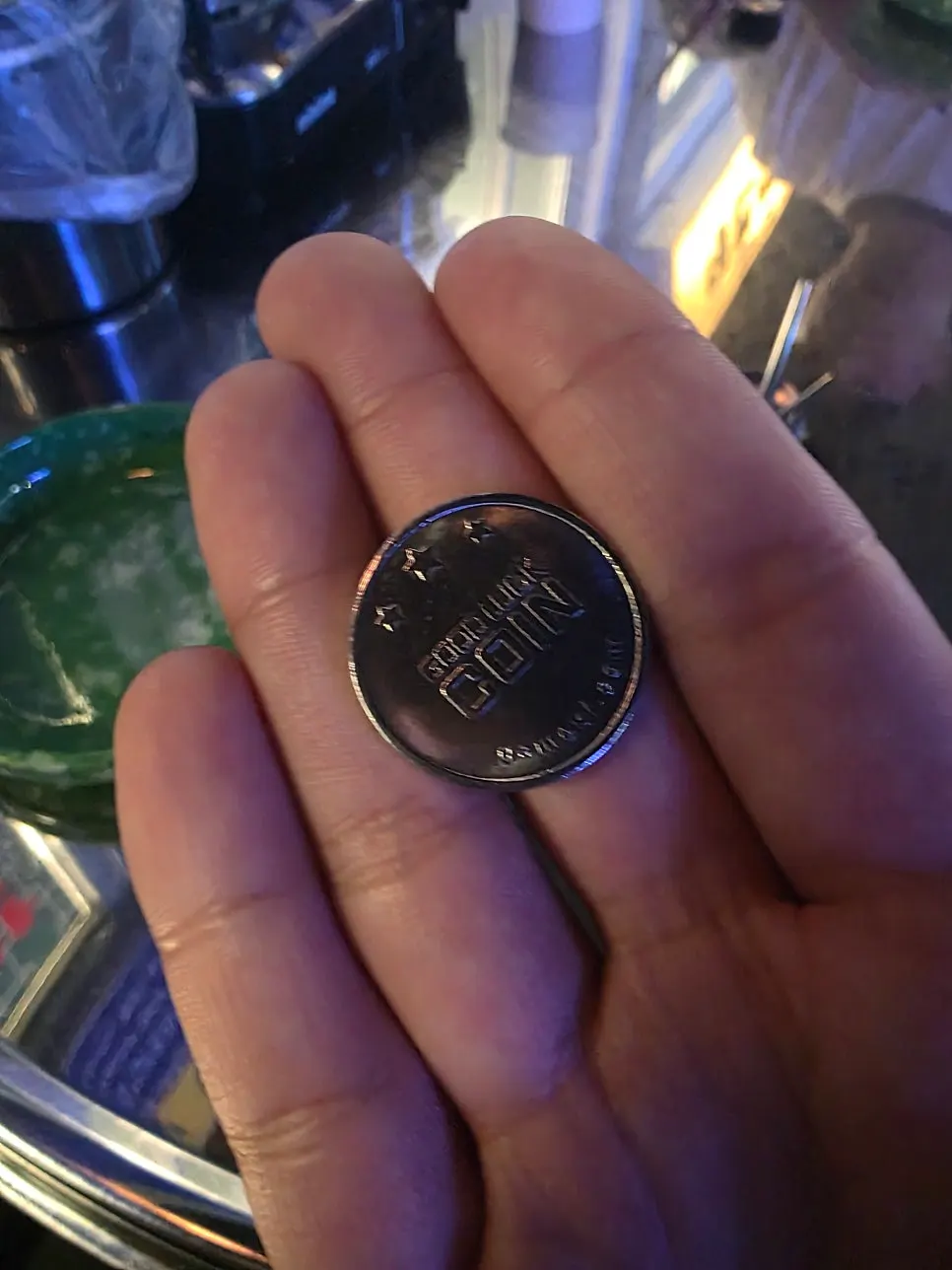 Sign explaining the coin event given with each order