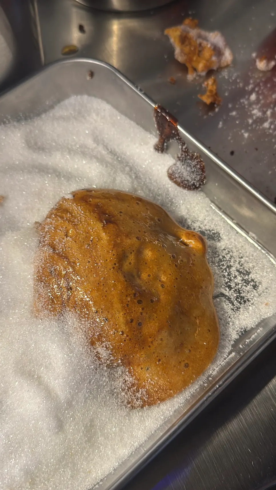 Process of melting sugar to make dalgona candy