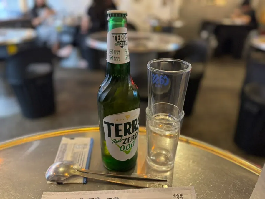 Non-alcoholic beer and a makchang table setting