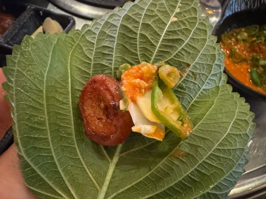 Seasoned makchang served in a ssam wrap