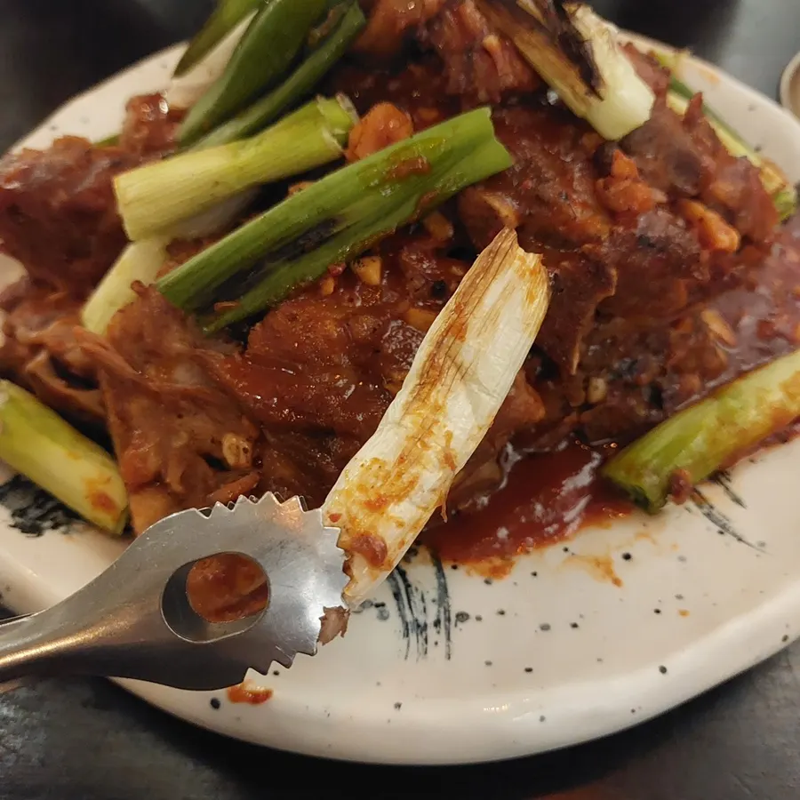 Sweet-spicy sauced bone BBQ with grilled scallions
