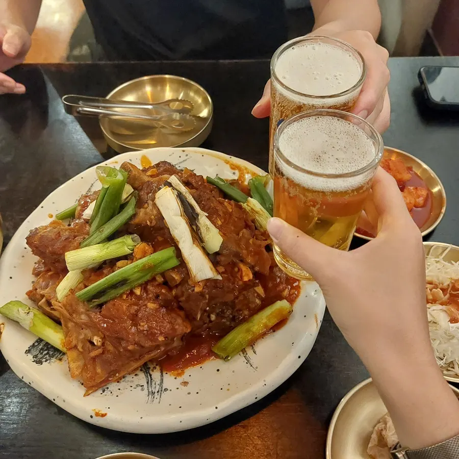 A glass of beer paired with the bone BBQ