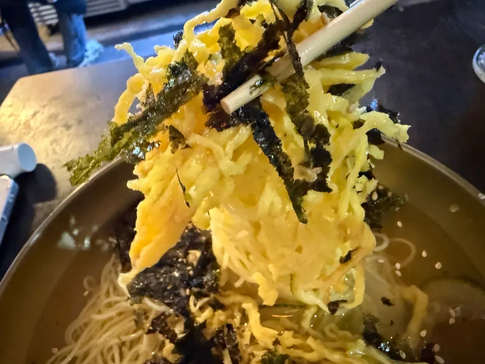 Jachi guksu enjoyed alongside grilled bones