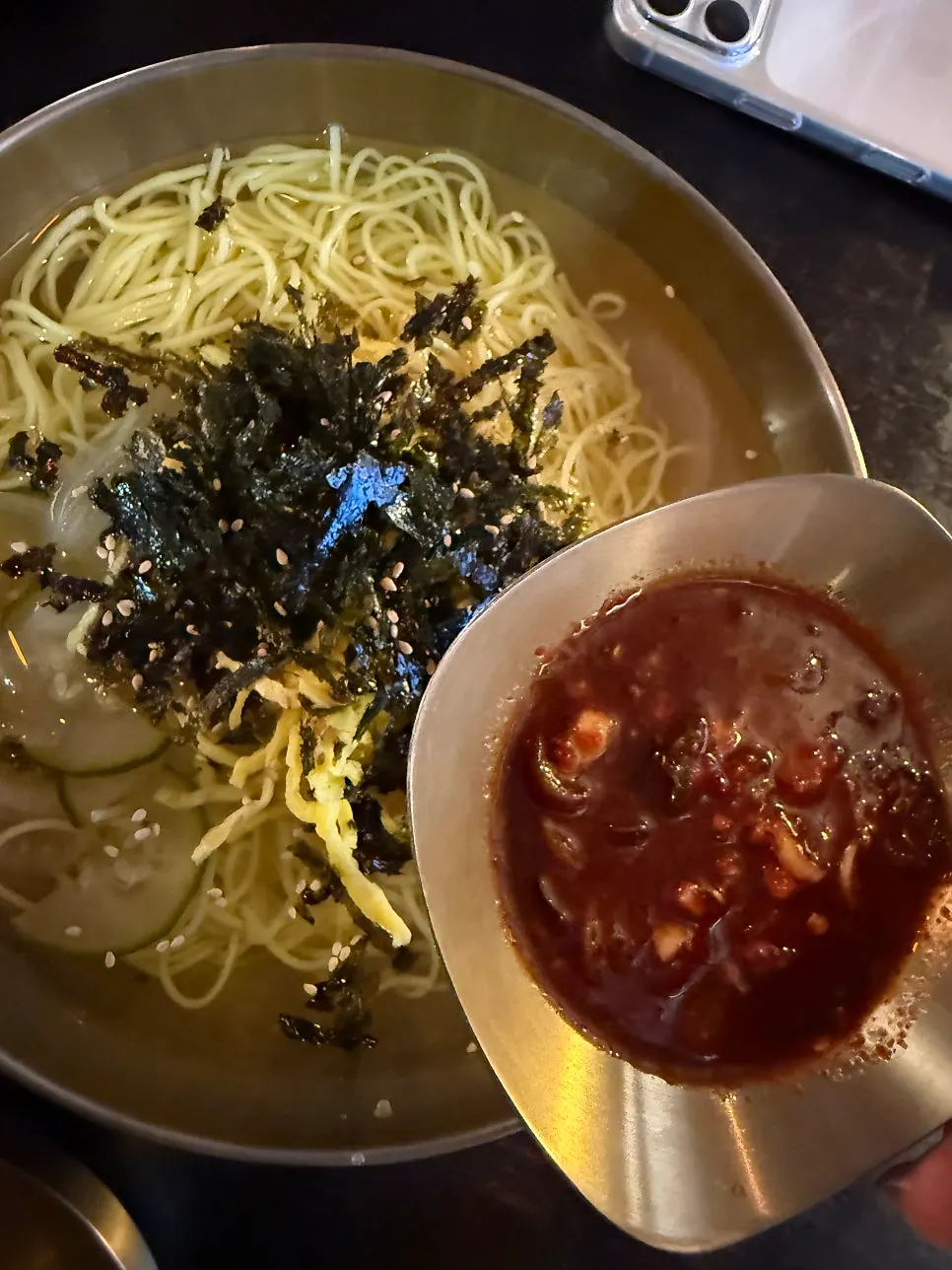 Jachi guksu made spicier with added seasoning sauce