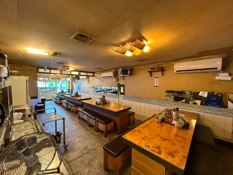 View of the restaurant with cooking underway in the kitchen