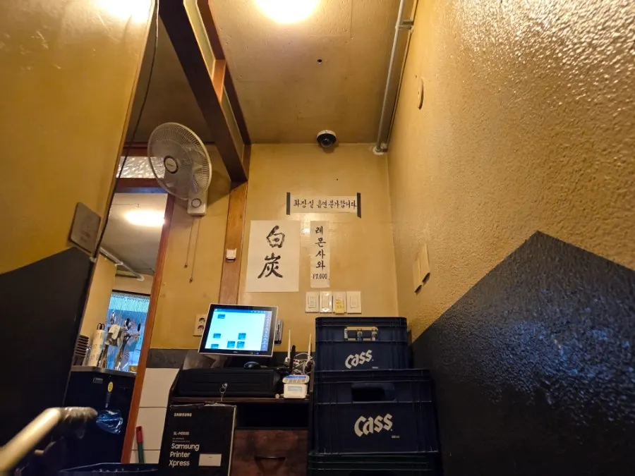 Celebrity autographs and a TV show poster on the stairs to the 2nd floor