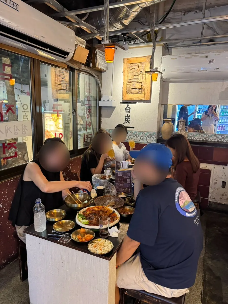 The packed Eulji Baektan Ppyeogui interior at dinner