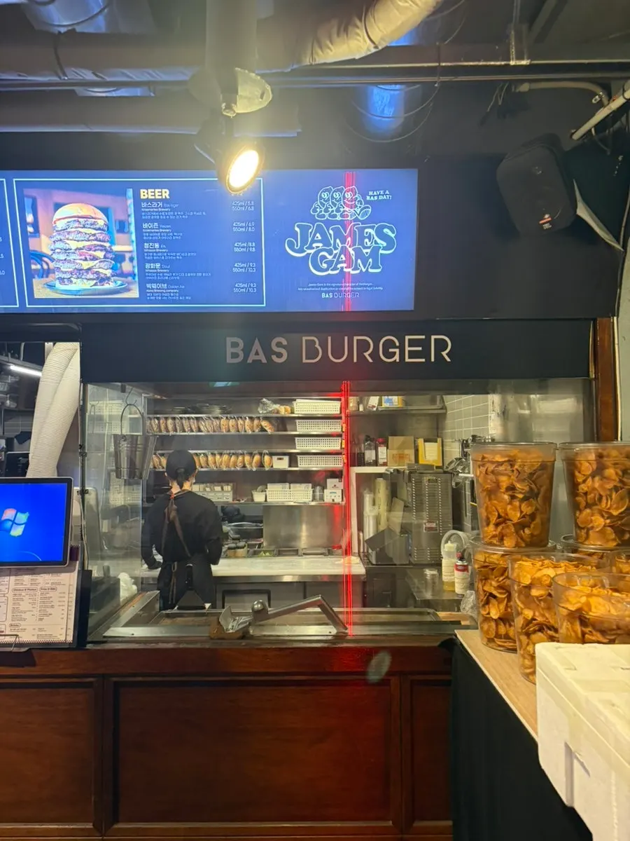 Stairs leading down to the basement entrance of BAS Burger