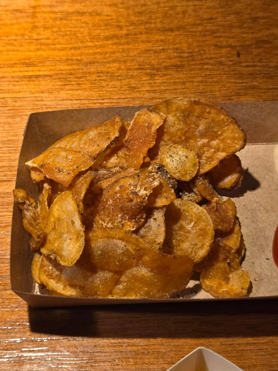 Free potato chips in a large container