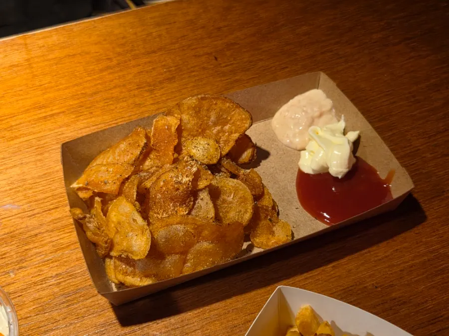 Potato chips dipped in sauce