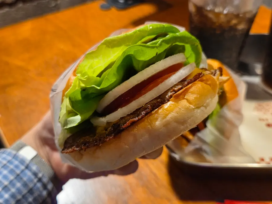 BAS Burger showing the soft bun and fresh vegetables