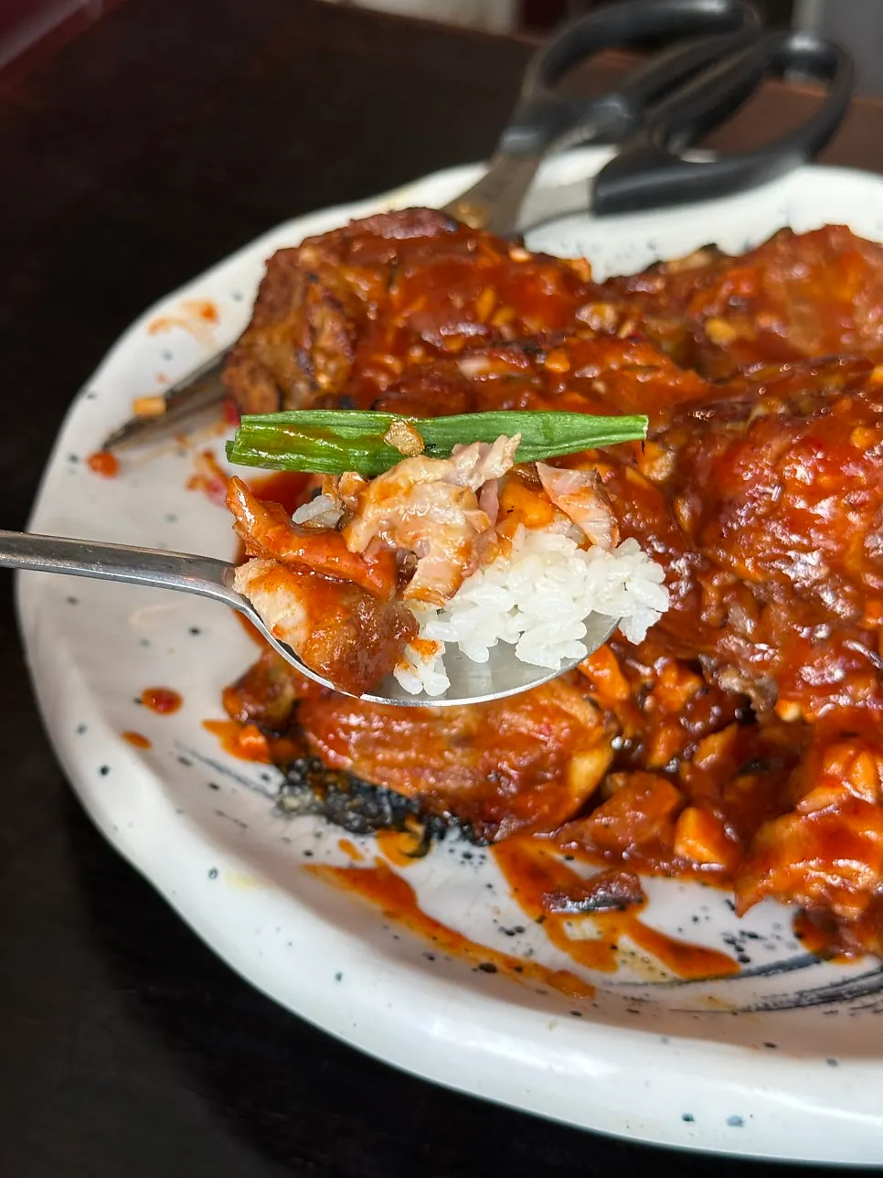 Grilled bones eaten with a bowl of rice