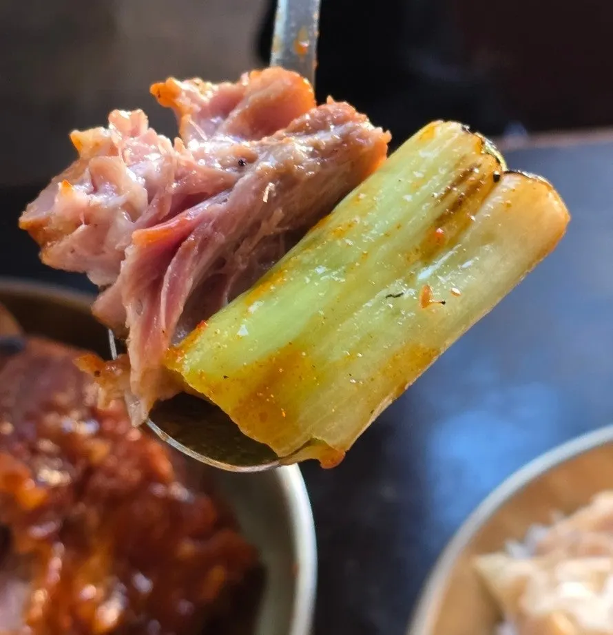 A bone piece with plenty of meat still attached