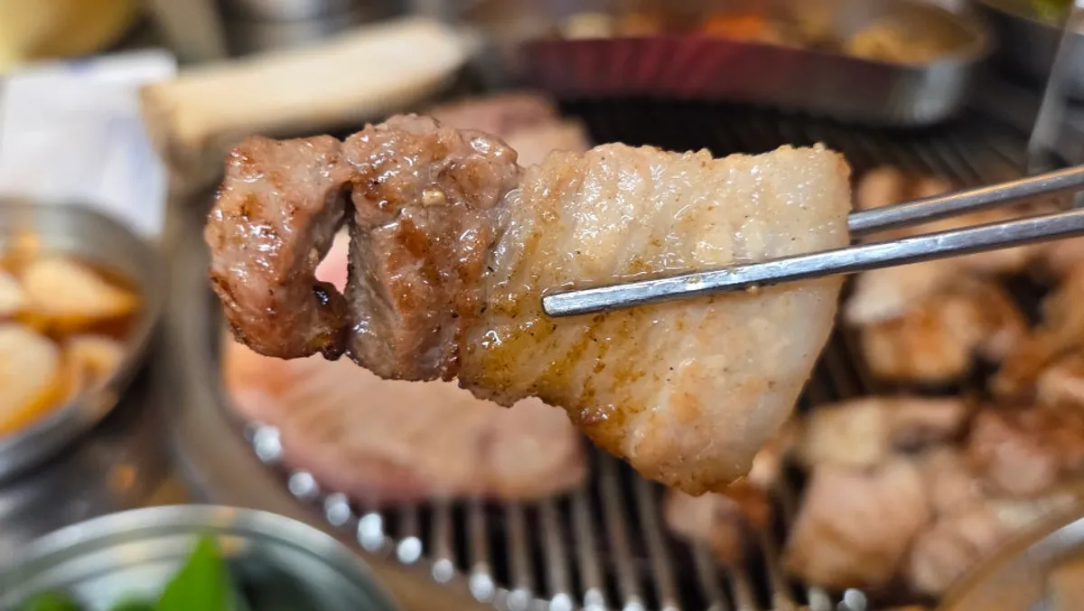 Pork belly browning on the grill