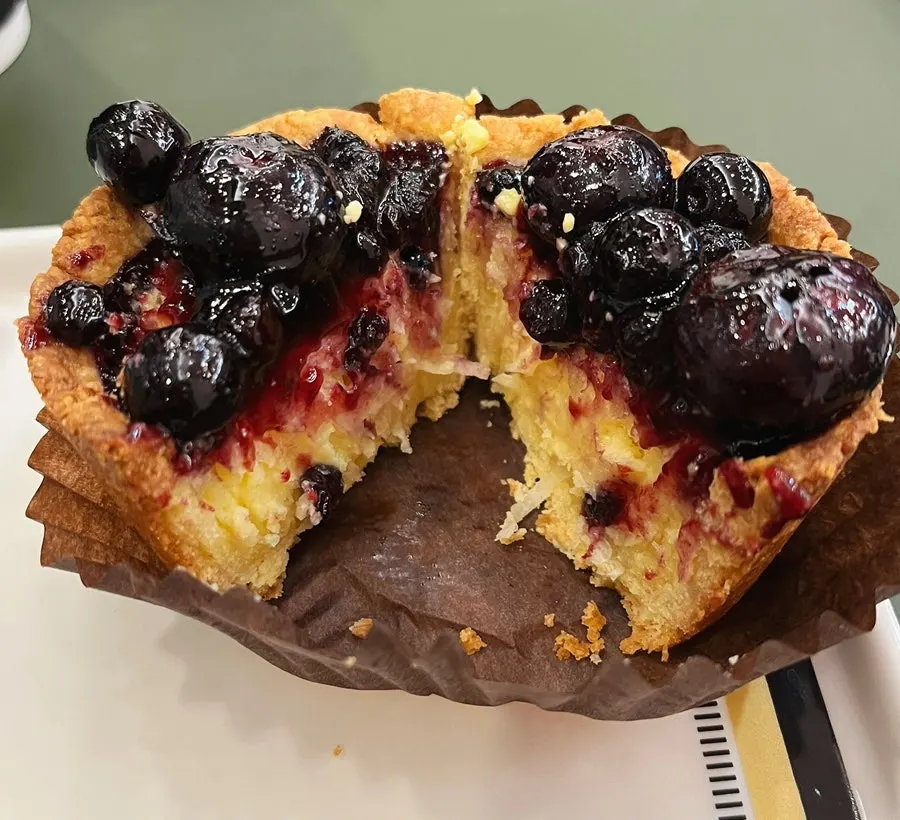 Blueberry tart topped with large berries
