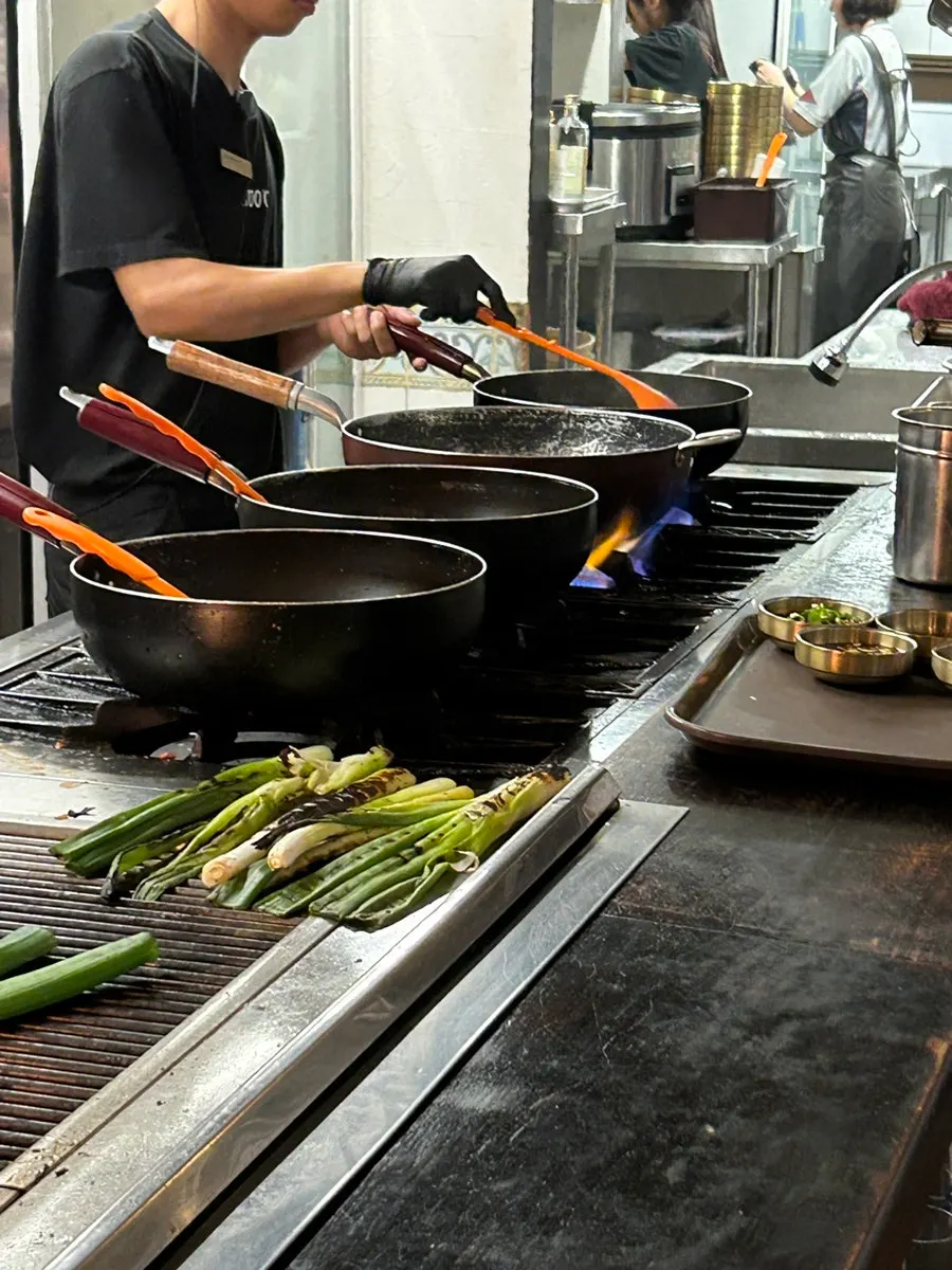 Odregi being cooked with smoky charcoal flavor