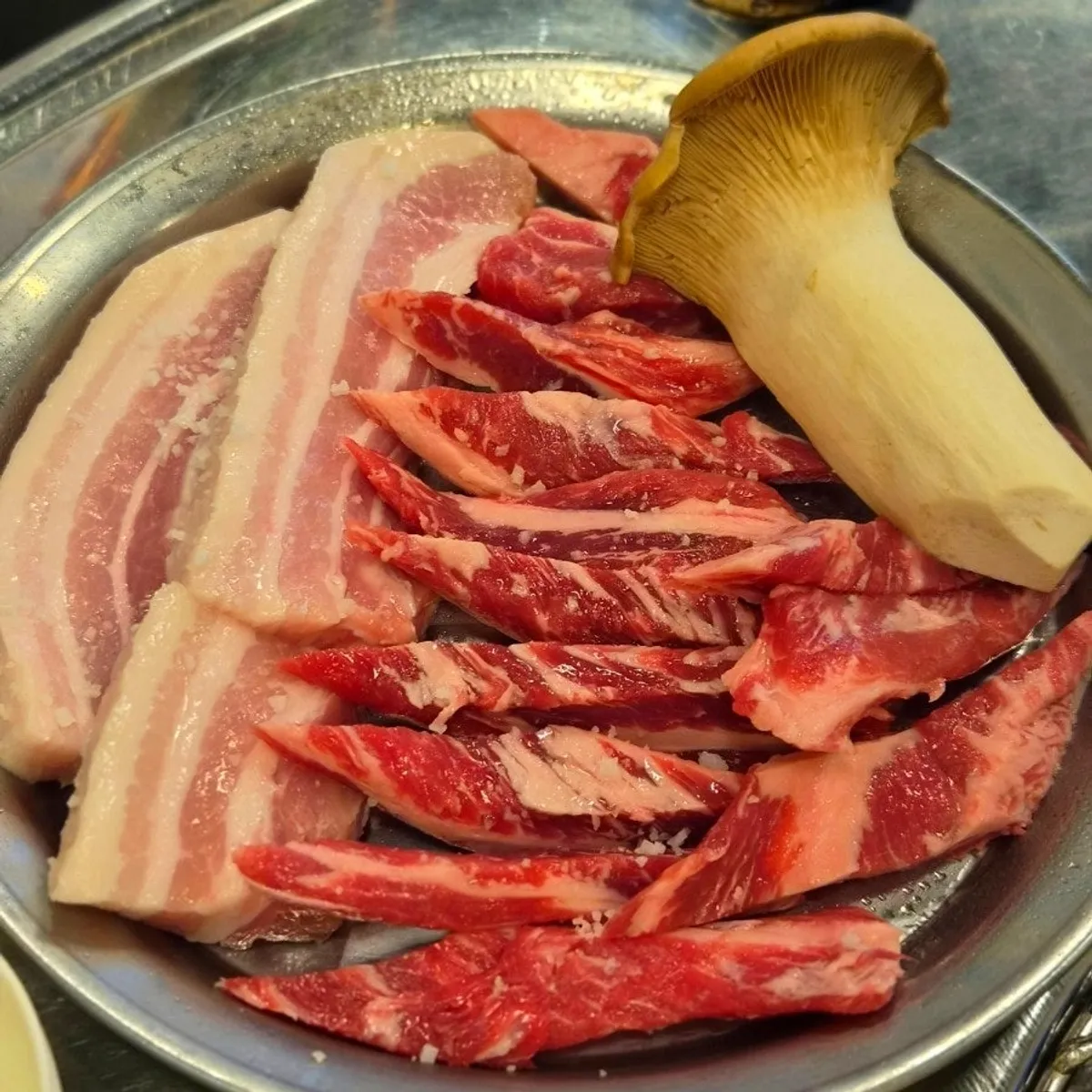 Charcoal fire and grill pan set at the table