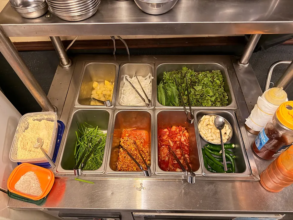 Plate of lettuce, perilla leaf and other vegetables from the self-serve bar