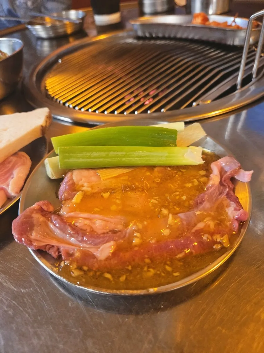 Pork jowl dipped in myeoljeot (salted anchovy sauce)