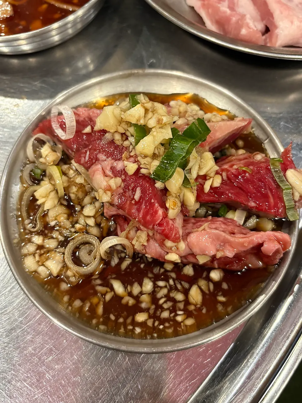 One serving each of pork jowl and gochujang pork belly