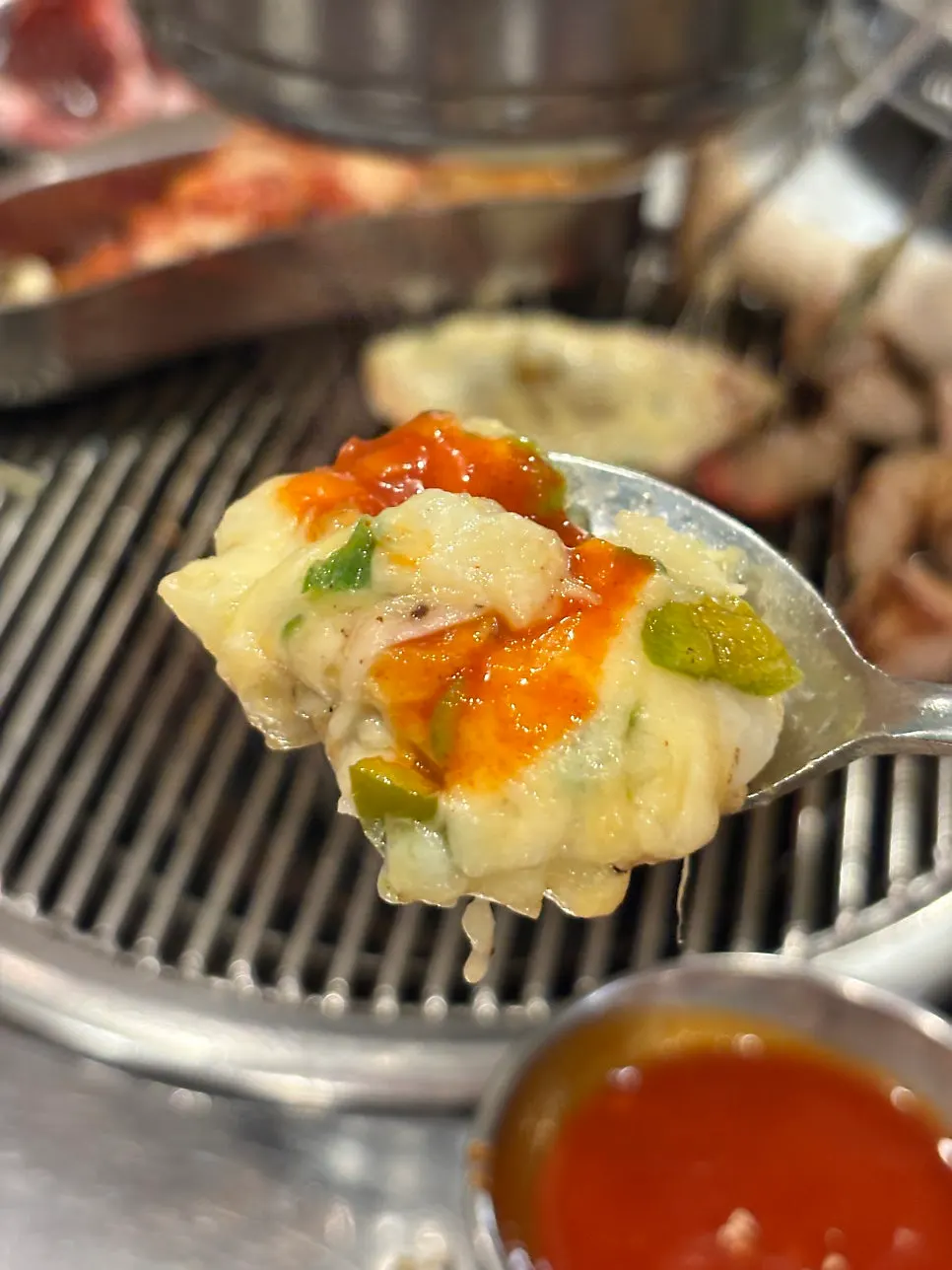 Meat and cheese scallops on the charcoal grill