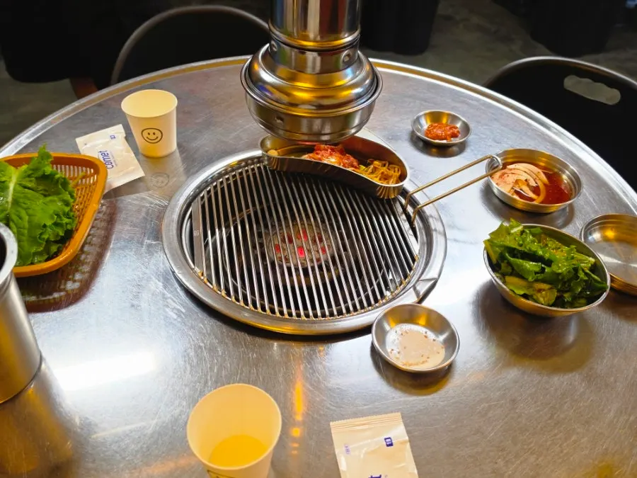 Charcoal grill set up at each table