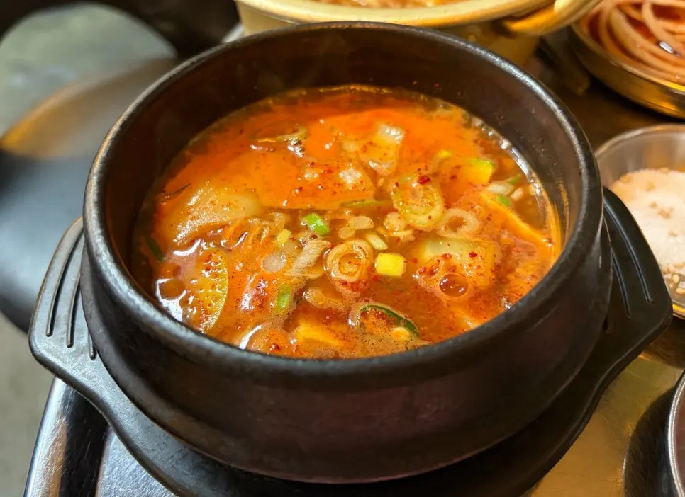 Old-style doenjang stew served alongside the meat