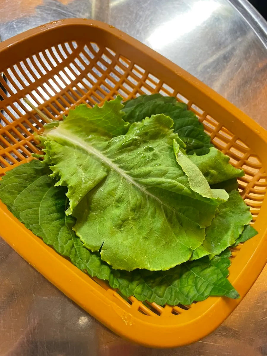 Plate of side dishes served with wrap lettuce