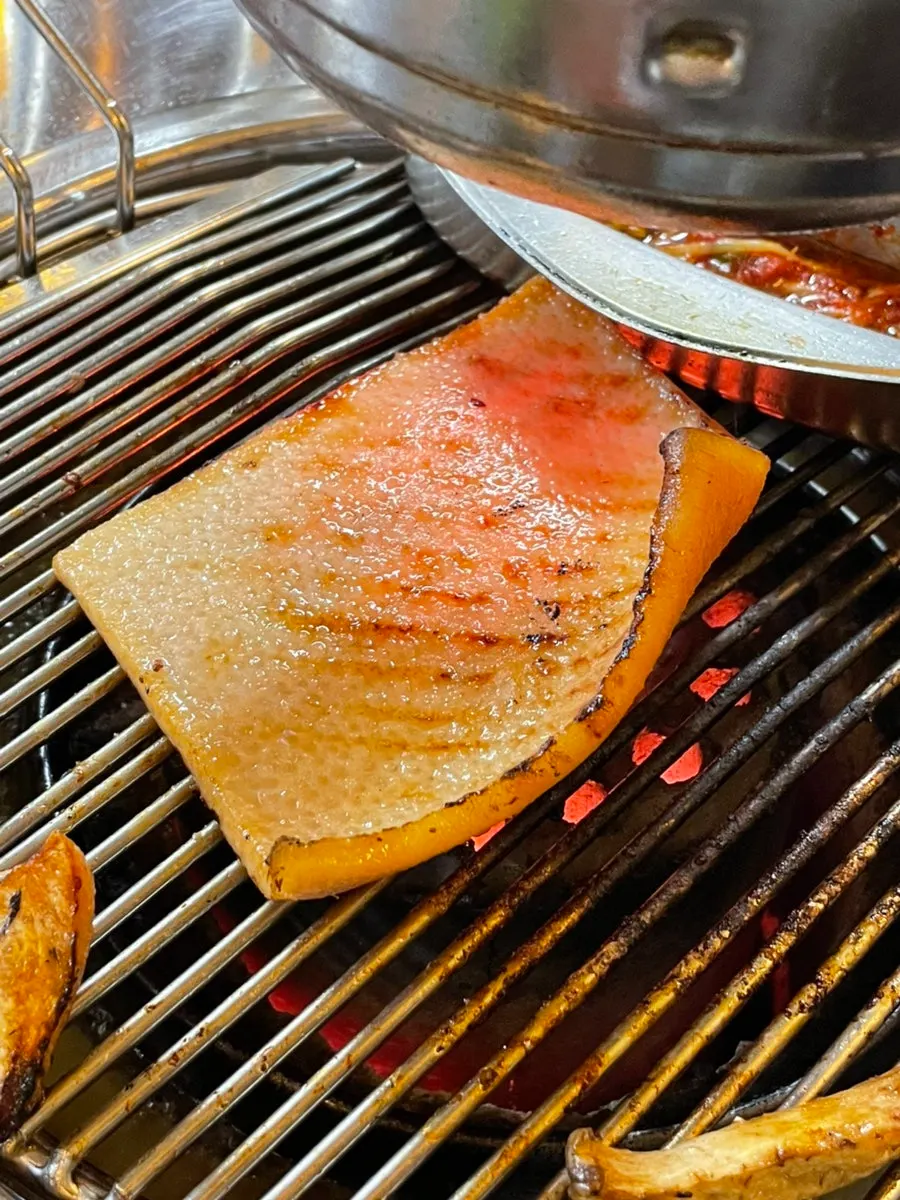 Golden-brown pork belly and pork jowl