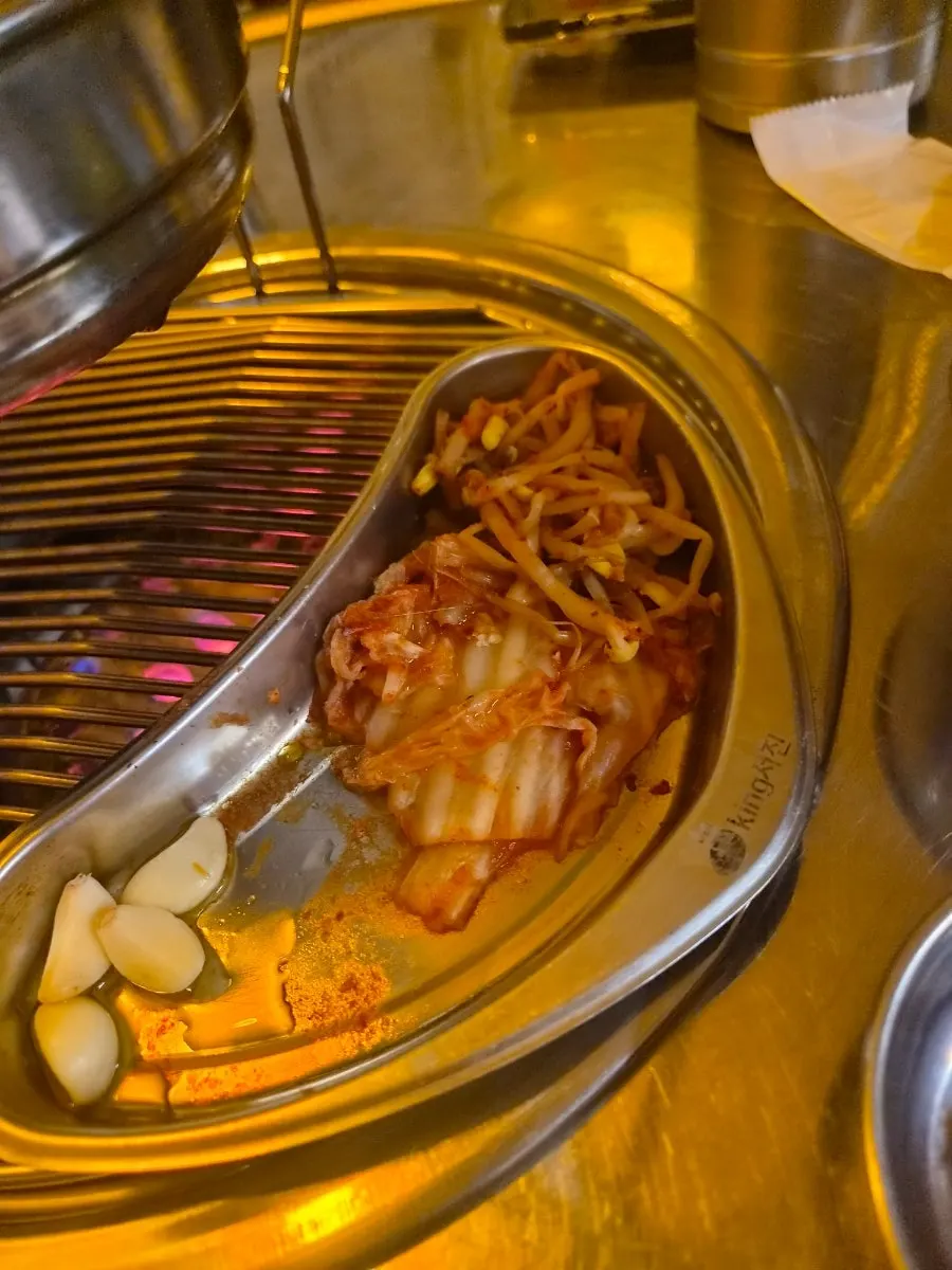 Grilling tray with kimchi, bean sprouts, and garlic