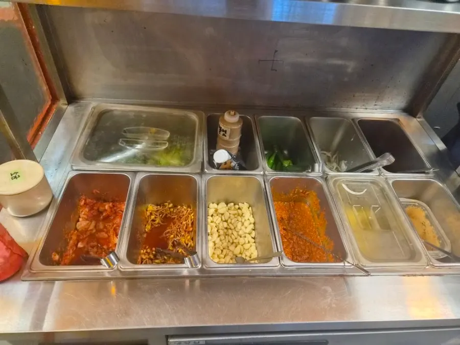 Side dishes and pineapple at the self-serve bar
