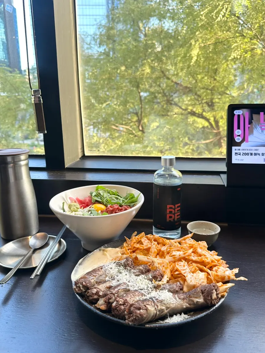 Ordered food set before the floor-to-ceiling window view