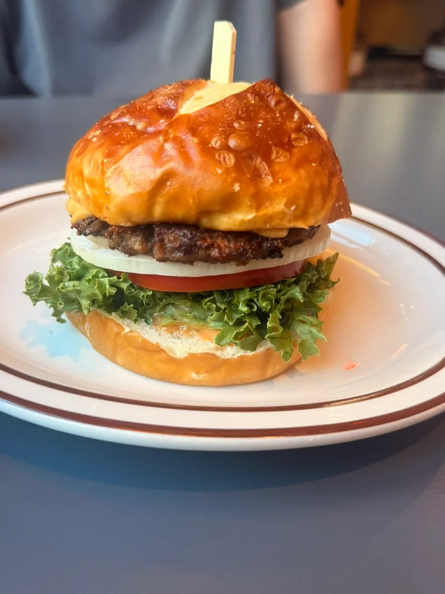 Cross-section of a Classic Burger with Hanwoo patty, onion, and tomato