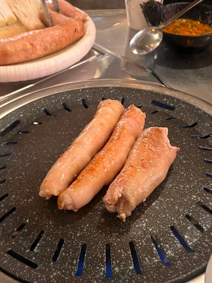 Thick Daegu makchang being pre-seared on the grill