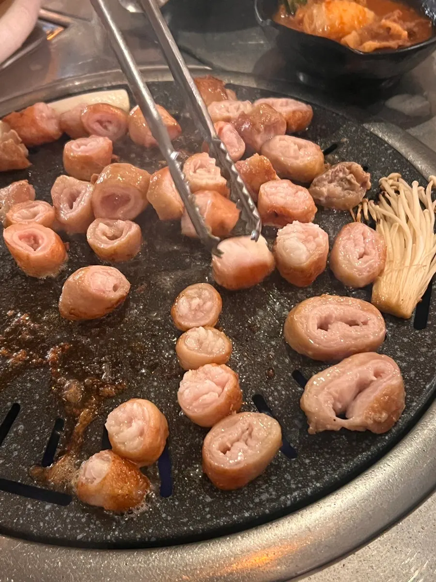 A piece of Daegu makchang dipped in makjang