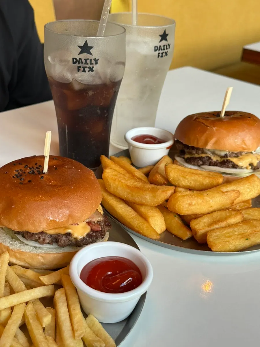 Taking a bite of the burger