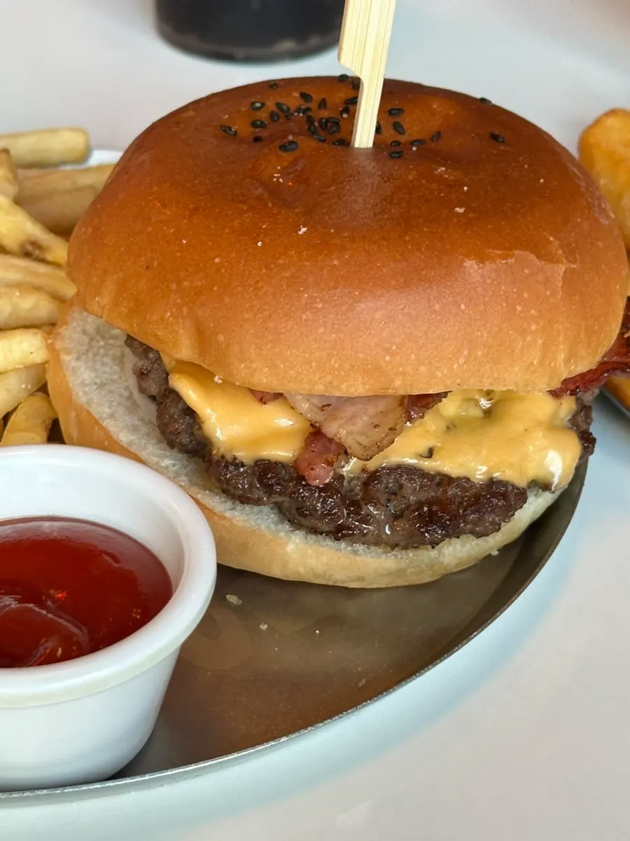 Burger and fries spread on the table
