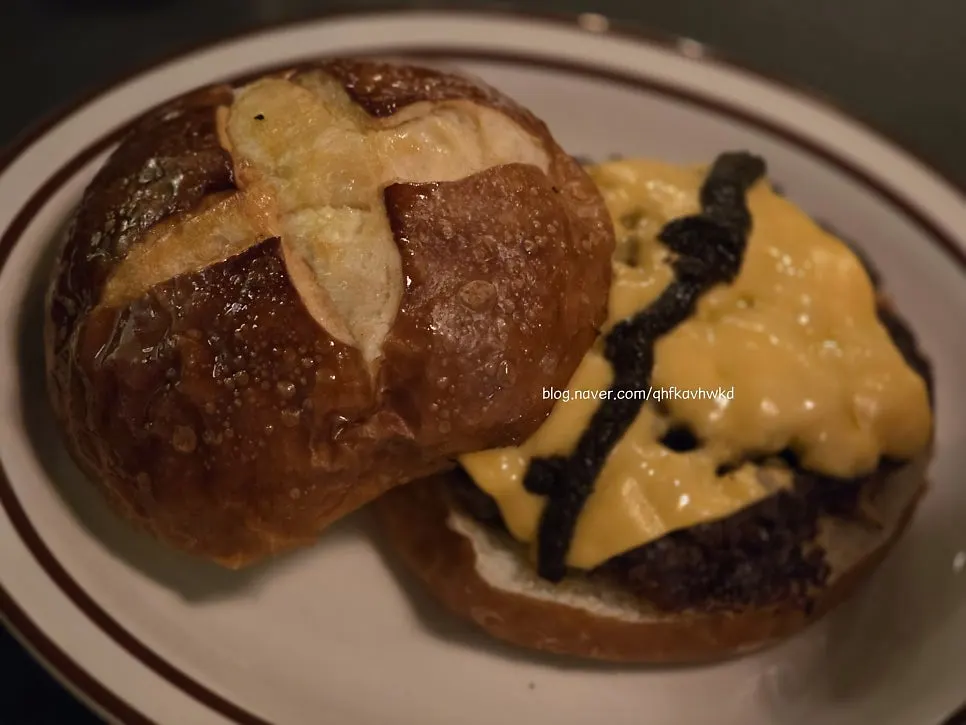 Triple mushroom burger with a pretzel bun